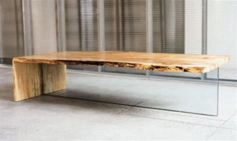 Their massive wood construction accentuates yet the sophisticated construction makes the coffee tables suitable for even the sleekest contemporary interior. Contemporary Coffee Table Of Rustic Wood - DigsDigs