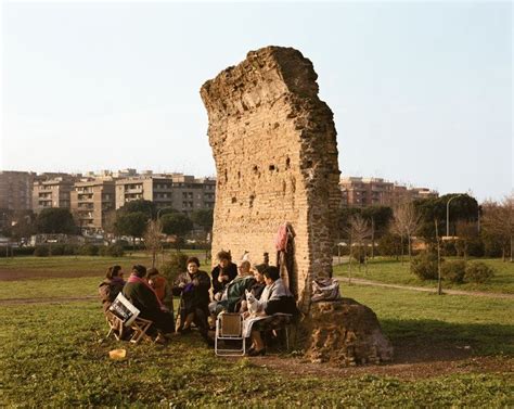 Women At A Daily Gathering Beside An Ancient Roman Wall Parco Dei
