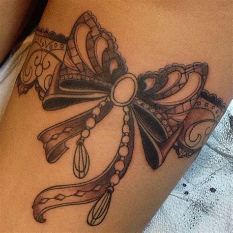 Most people tend to get a back tattoo that sits either to the side, underneath their shoulder, or down their spine; Tattoo Thigh on Pinterest | Lace bow tattoos Bow tattoos and Pink bow | Tattoos | Pinterest ...