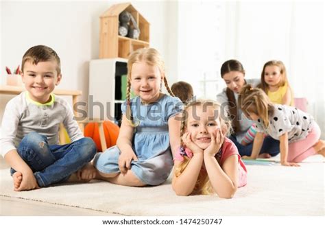 Playful Little Children Resting On Floor Stock Photo 1474250747
