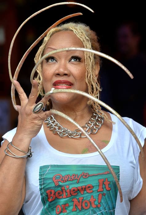 Woman With Longest Nails In The World Finally Cuts Them