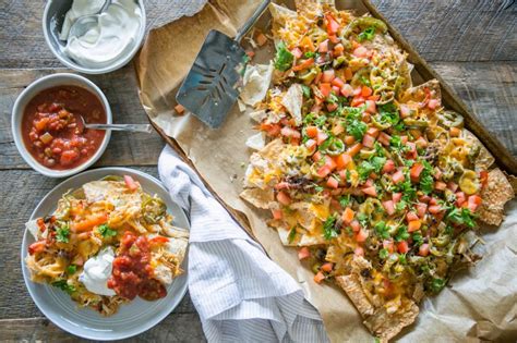 To make chicken fajita nachos start by marinating the chicken (cut in bite size pieces) in a combination of lime juice and spices (cumin, onion salt, chili powder & cayenne pepper) for at least 30 minutes or up to a day. Chicken Fajita Nachos - Primal Palate | Paleo Recipes