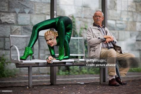 Contortionist Zlata Poses At A Bus Stop During A Photo Shooting In