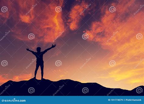 Silhouette Man Standing On Mountain Sunset Background Royalty Free