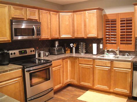 Our kitchen has honey oak colored cabinets (built in 1980s) which we don't plan to paint or restain yet. Kitchen | Remodelaholic | Complete Kitchen Transformation; White Cabinets | Honey oak cabinets ...