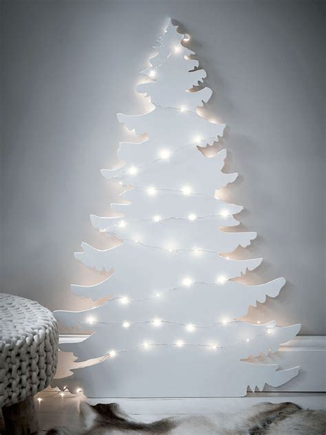 Christmas tree on the wall decor. 12 Modern Christmas Trees You Can Decorate With This Holiday Season