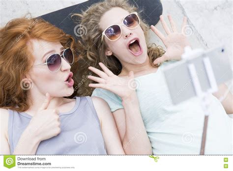 Zuzinka invite her friend for a bottle of wine. Enjoying The Summer With Funny Faces Stock Photo - Image ...