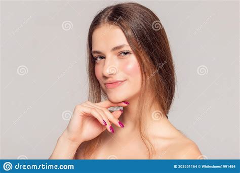 Beautiful Young Woman With Clean Fresh Skin Touch Own Face Stock Photo