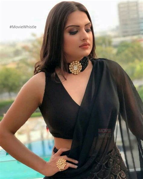 In A Black Sheer Saree And Sleeveless Blouse Design Black Saree Blouse Designs Sleeveless