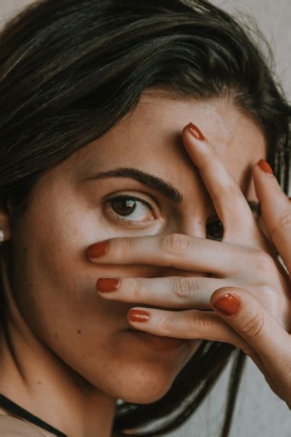 Premium Photo Close Up Portrait Of Woman Covering Face With Hand