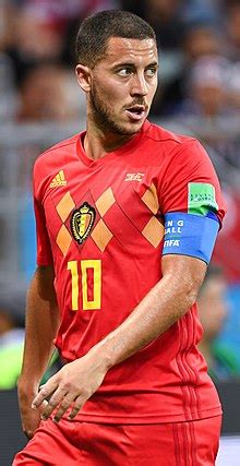 His father thierry was a defensive midfielder who played for 'la louvière' in the 'belgian second division,' while his mother carine was a striker in the 'belgian women's first division.' Eden Hazard - Wikipedia