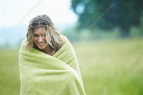 woman wrapped in blanket outdoors stock image f005 1208 science photo library