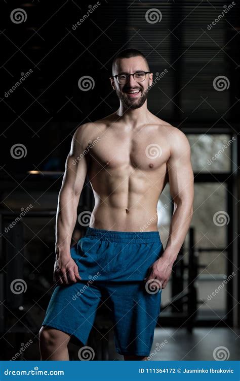 Nerd Man Standing Strong In Gym Stock Photo Image Of Flexing Body
