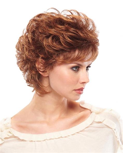 Layers Of Large Playful Curls And Face Framing Bangs Make This Short