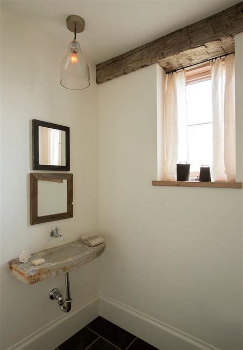 Rustic Powder Room With Concrete Wall Mount Sink And Stacked Mirrors
