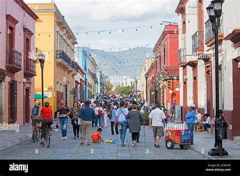 Mexicans Walking In Pedestrian Zone With Colourful Shops In The