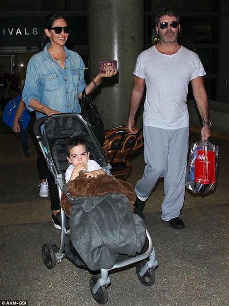 scruffy simon cowell jets into lax with lauren silverman and mini me son eric daily mail online