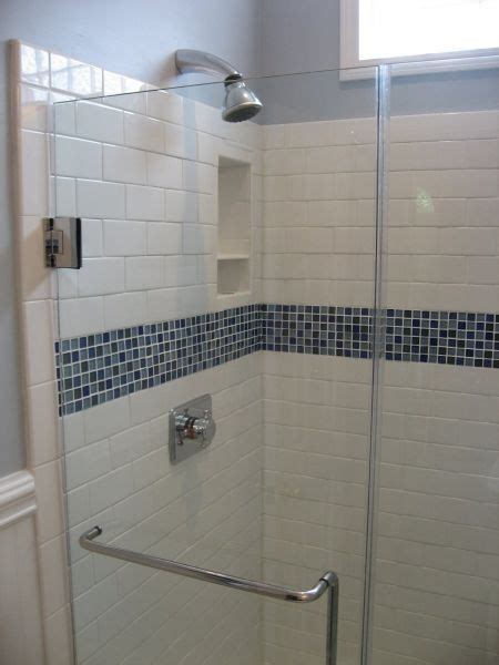 This image is our most popular on pinterest. White subway tile with glass tile decorative band for ...