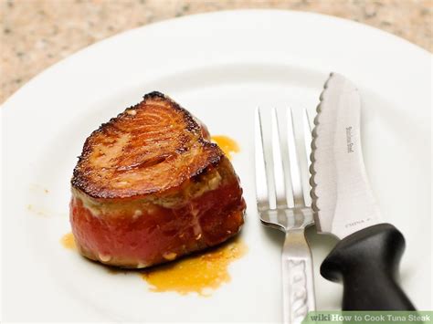 Finish strong slice the tuna steaks across the grain. Simple Ways to Cook Tuna Steak - wikiHow