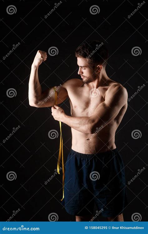 Strong Muscular Man Measuring Biceps Muscular Man Measuring His Biceps
