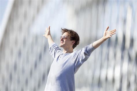 Excited Young Man Stretching Out His Arm In Emotion Stock Photo Image