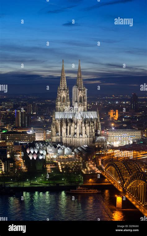 Evening View Of Skyline Of Cologne Germany With Floodlit Cathedral