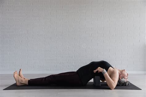 Mature Caucasian Woman Practicing Yoga On The Living Room Floor Stock Image Image Of
