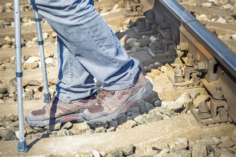 Disabled Man With Crutches On Railway Stock Image Image Of Illness