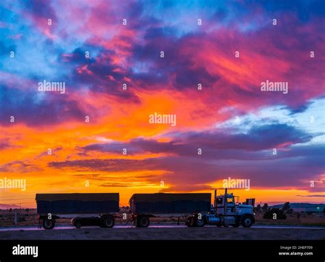 Truck On The Road With Colorful Sunset Cloudy Sky Stock Photo Alamy