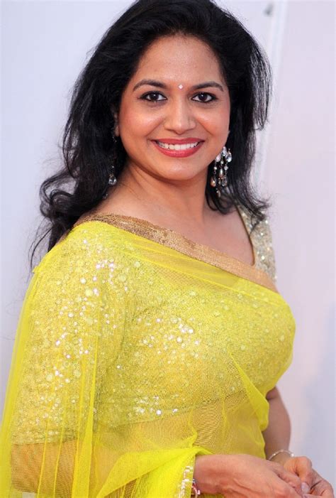 Tollywood Singer Sunitha Stills In Transparent Yellow Saree And Golden Matching Blouse Indian
