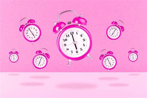 Premium Photo Pink Alarm Clocks