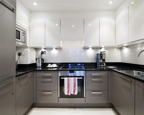 This kitchen design utilizes multiple shades of grey to provide the perfect amount of contrast against the white shaker cabinets and white countertops. Contemporary Grey Kitchen Design Ideas, Photos ...