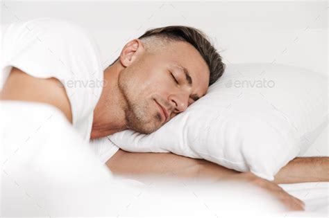 Handsome Man Sleeping In Bed Stock Photo By Vadymvdrobot Photodune