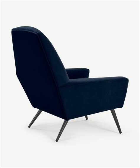 Weight capacity and a 17.5 seat height. Roco Accent Armchair, Ink Blue Velvet | MADE.com