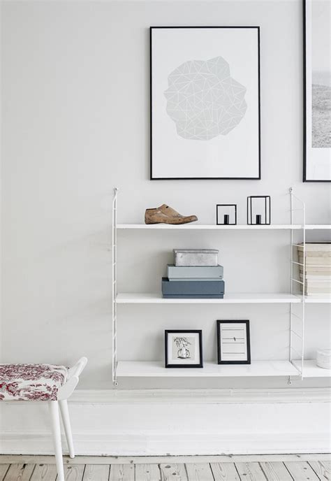 Modern interior design in scandinavian style with shelf and bike. Six of the best.... Scandinavian shelving systems | These Four Walls