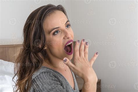 Sleepy Young Woman Yawning In Bed At Home 7548445 Stock Photo At Vecteezy