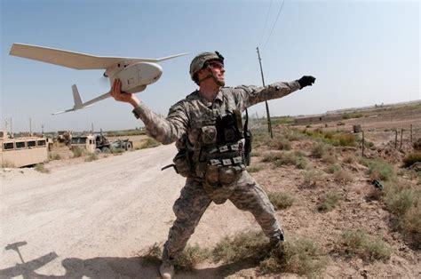 A Us Army Soldier Launches A Raven Hand Held Drone In Iraq