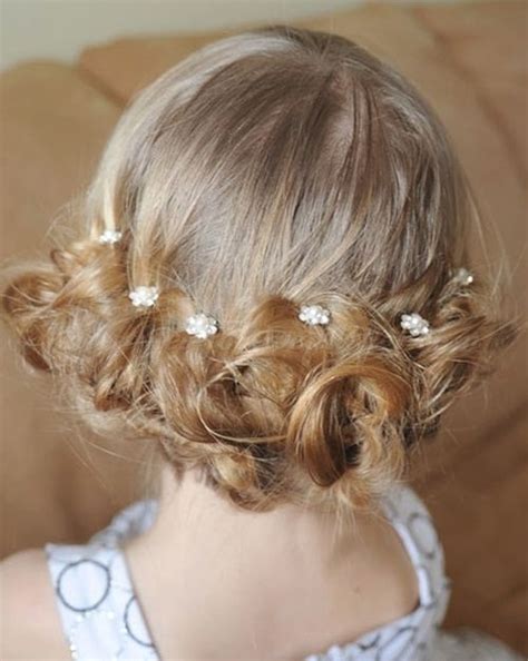 When your toddler can barely walk—let alone has hair—your best option for short hair is a blooming headpiece to complement a fluffy white dress. flowergirl hairstyles - low bun for flower girls ...
