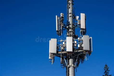 Closeup Of Wireless Cell Site Antennas On A Monopole Tower Against A