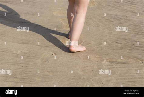 Child Feet Barefoot Walking On Sand Beach Stock Photo Alamy