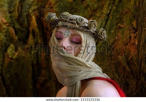 Portraits Of A Semi Nude Woman Posing Inside A Large Hollow Oak Tree