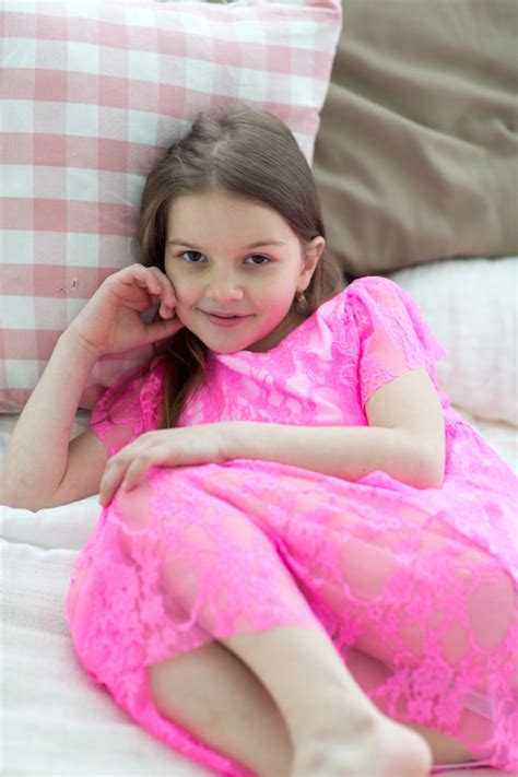 Pretty Little Girl In Pink Princess Dress In Bed With