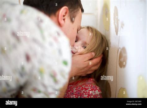 Close Up Of A Father Kissing His Daughter Stock Photo Alamy
