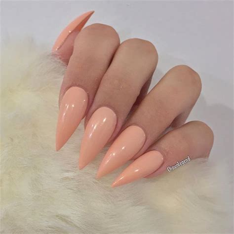 The gentle short nails can have a smooth transition of colors and hence getting an awesome ombre design. peach nail polish on claw nails | Peach nails
