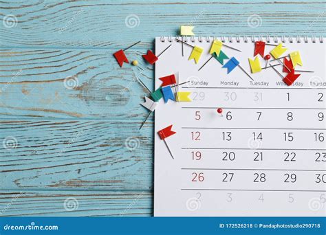 Planning Calendar With Many Pins On A Blue Wooden Background Important