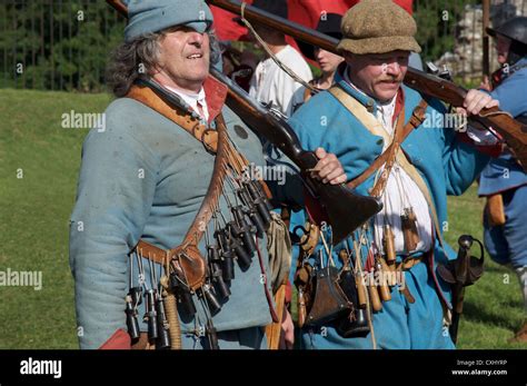 English Civil War Reenactors In The Uniform Of Royalist Musketeers At A