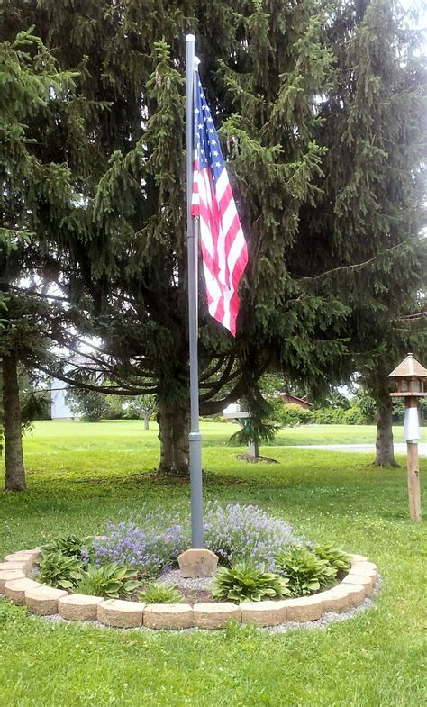 Maybe you would like to learn more about one of these? Down by the pond | Flag pole landscaping, Garden poles ...