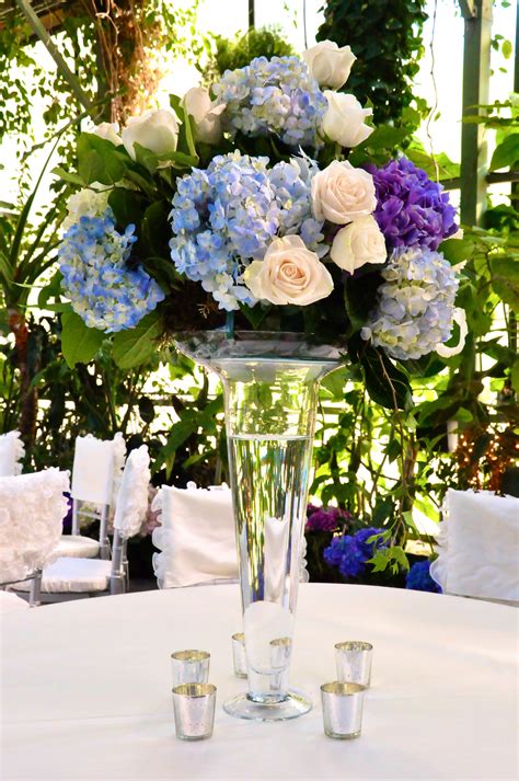 tall centerpiece with blue hydrangea and vendella roses white hydrangea centerpieces large