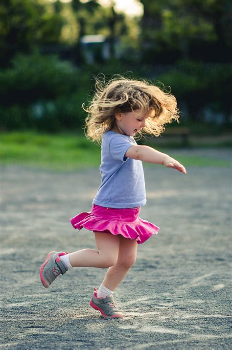 Little Girl Spinning Around And Dancing By Stocksy Contributor