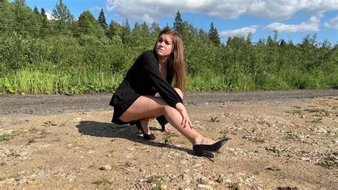 Aliona Twisted Ankle Girl Walks In One Shoe Twisted Ankle Girl High Heels On Gravel